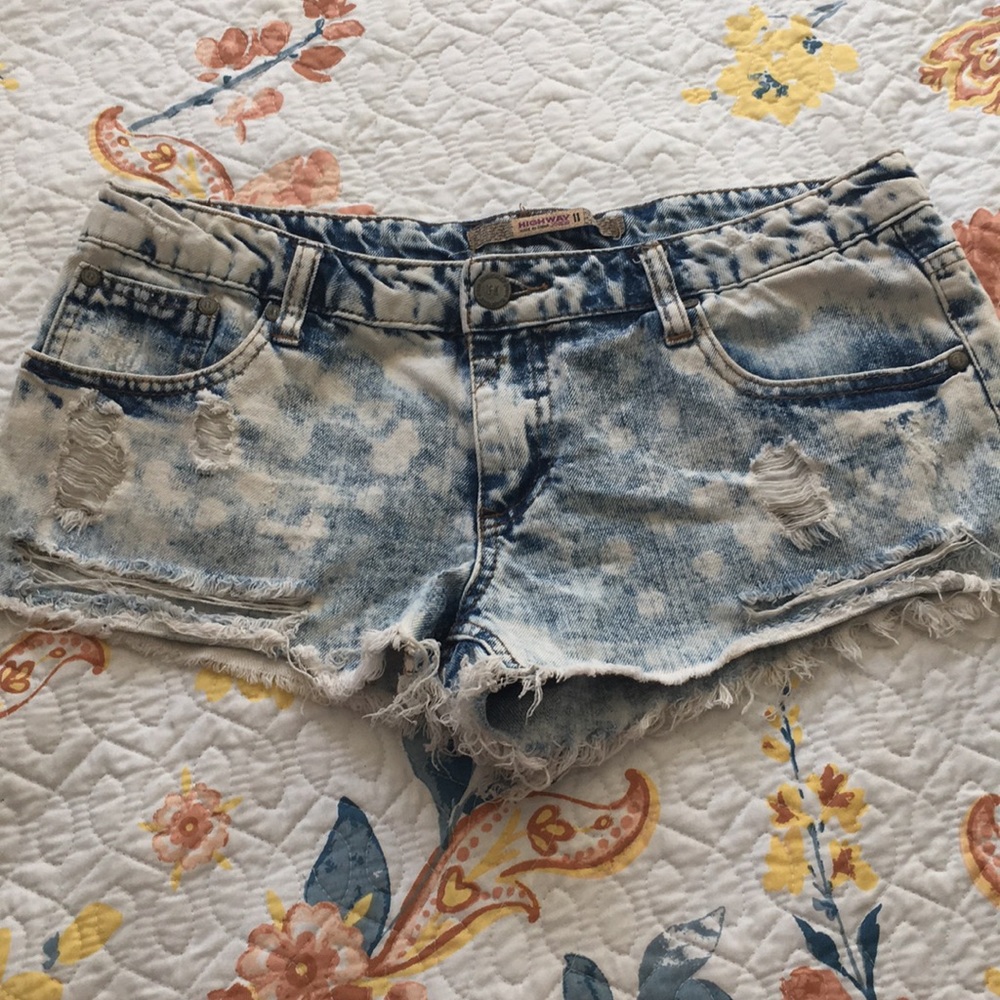 Distressed acid-wash denim shorts